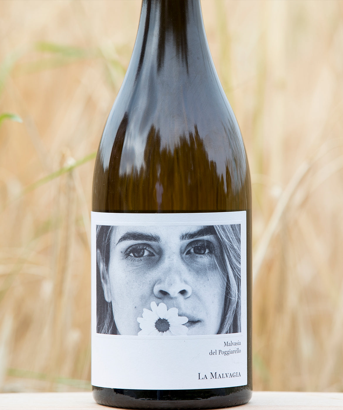La Malvagia Malvasia Emilia IGT 2022 hvidvin flaske med poetisk etiket med kvinde og blomster